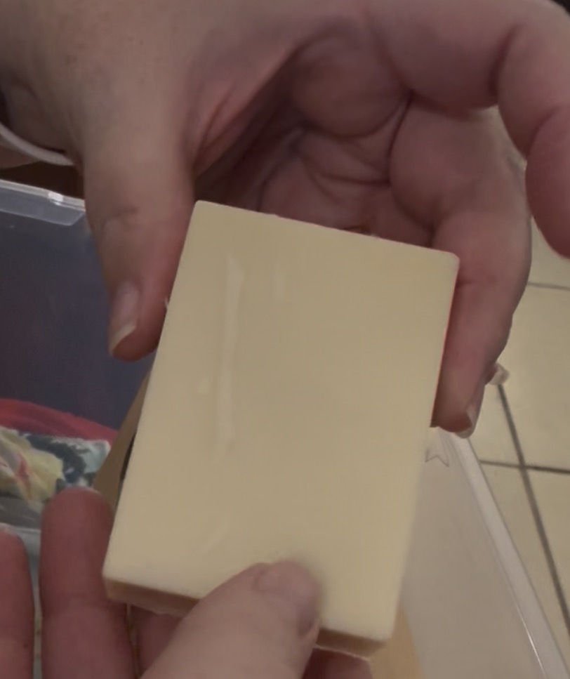 Handmade Allergy Friendly tallow soap bar held in hand